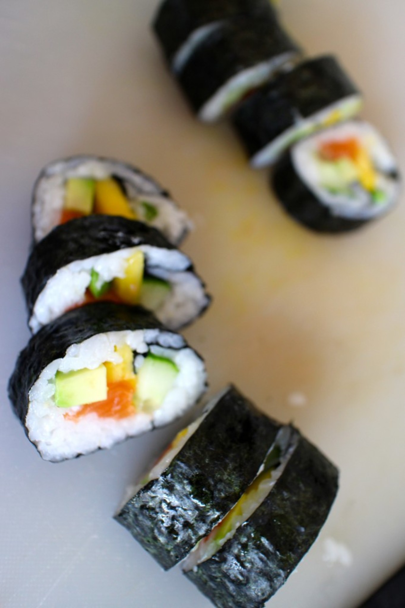 And Done!  Here you have  Salmon Maki with cucumber and mango.  You can add any kind of roe  and sesame seeds. 